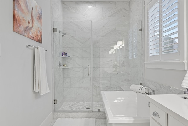 11 Caravelle Ct, Galveston, TX 77554 - bathroom featuring a soaking tub, a shower stall, and vanity