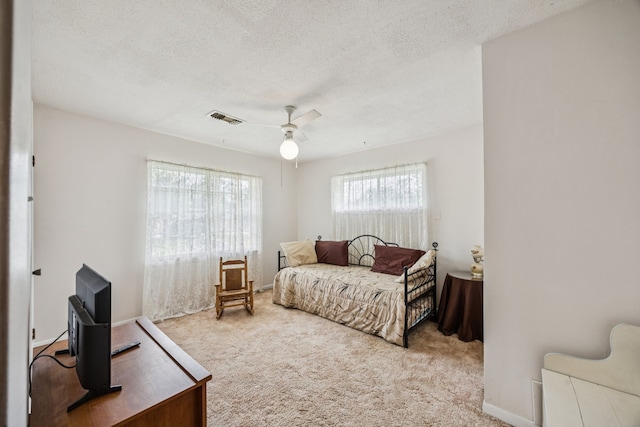 16219 Dundee Rd, Cypress, TX 77429 - carpeted bedroom featuring a textured ceiling and a ceiling fan