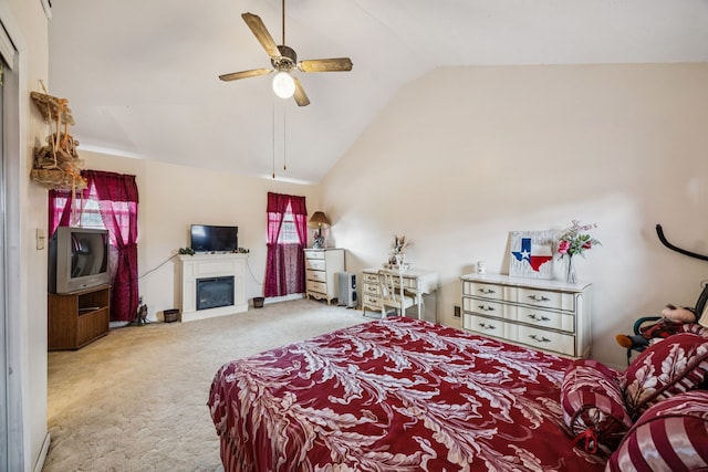 16219 Dundee Rd, Cypress, TX 77429 - carpeted bedroom featuring vaulted ceiling, multiple windows, a glass covered fireplace, and a ceiling fan