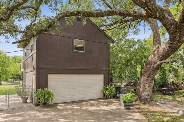 16219 Dundee Rd, Cypress, TX 77429 - view of front of house with a gate, driveway, and an attached garage