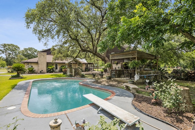 16219 Dundee Rd, Cypress, TX 77429 - outdoor pool featuring a gazebo, a diving board, a patio, and a yard