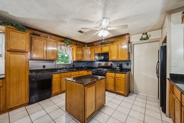 16219 Dundee Rd, Cypress, TX 77429 - kitchen with black appliances, brown cabinets, a sink, a kitchen island, and a ceiling fan