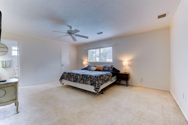 5638 Long Creek Ln, Houston, TX 77088 - carpeted bedroom featuring ornamental molding, baseboards, a ceiling fan, a textured ceiling, and ensuite bathroom