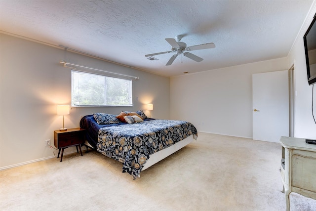 5638 Long Creek Ln, Houston, TX 77088 - bedroom with light carpet, ceiling fan, a textured ceiling, and baseboards