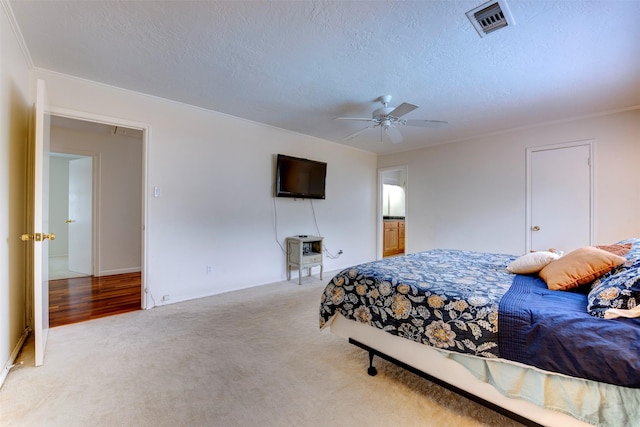 5638 Long Creek Ln, Houston, TX 77088 - bedroom with carpet floors, a textured ceiling, ornamental molding, baseboards, and a ceiling fan