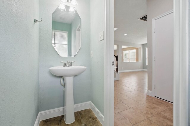 11707 Newel Elm St, Houston, TX 77038 - bathroom featuring tile patterned floors and baseboards