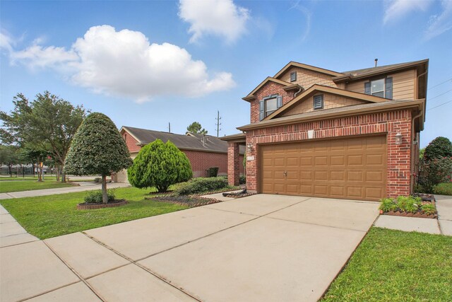11707 Newel Elm St, Houston, TX 77038 - view of front of property featuring concrete driveway, brick siding, an attached garage, and a front lawn