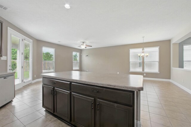 11707 Newel Elm St, Houston, TX 77038 - kitchen with dishwasher, light tile patterned flooring, a chandelier, and baseboards