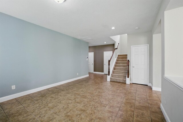 11707 Newel Elm St, Houston, TX 77038 - empty room featuring stairway, baseboards, and recessed lighting