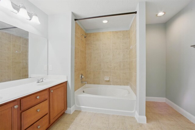 11707 Newel Elm St, Houston, TX 77038 - bathroom featuring washtub / shower combination, tile patterned floors, double vanity, and baseboards