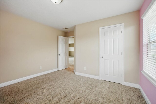 11707 Newel Elm St, Houston, TX 77038 - unfurnished bedroom featuring carpet flooring and baseboards