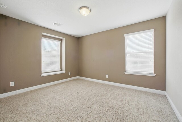11707 Newel Elm St, Houston, TX 77038 - carpeted empty room featuring baseboards
