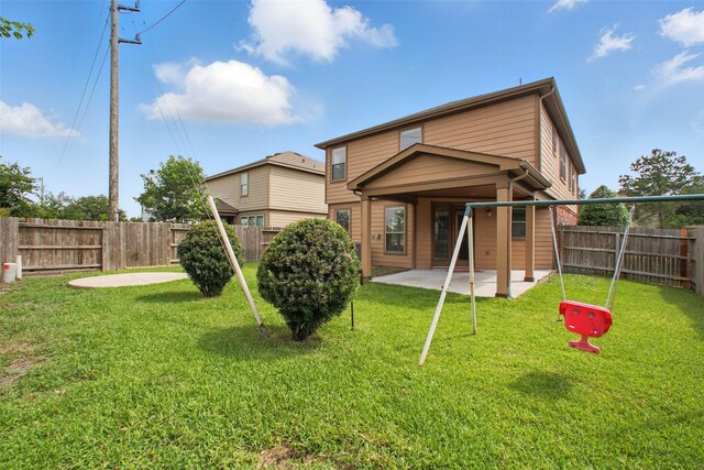 11707 Newel Elm St, Houston, TX 77038 - rear view of house with a patio area