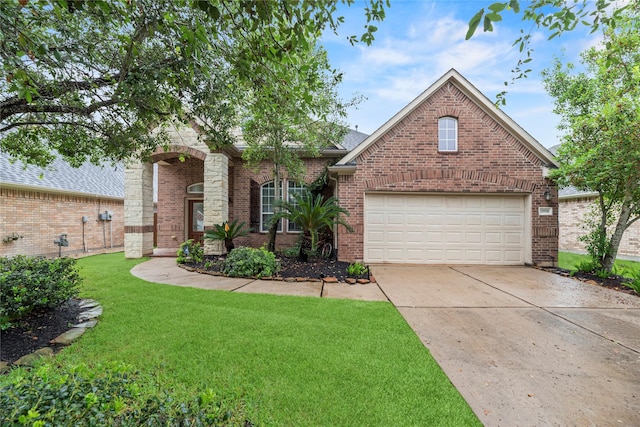 20918 Field Manor Ln, Katy, TX 77450 - traditional home with driveway, a front lawn, brick siding, and a garage