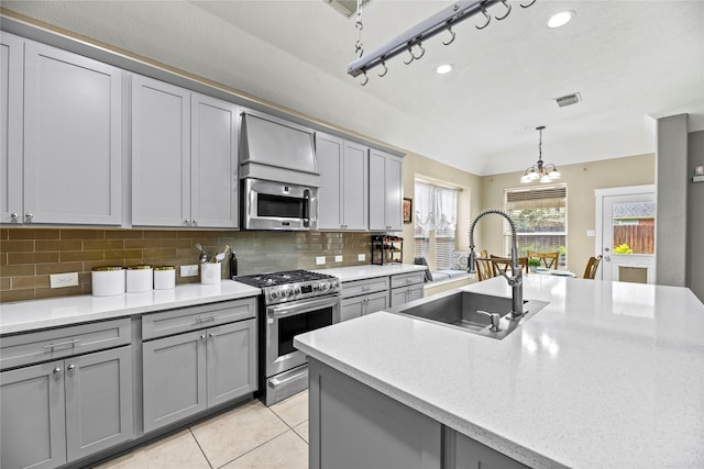 20918 Field Manor Ln, Katy, TX 77450 - kitchen with appliances with stainless steel finishes, gray cabinetry, and recessed lighting