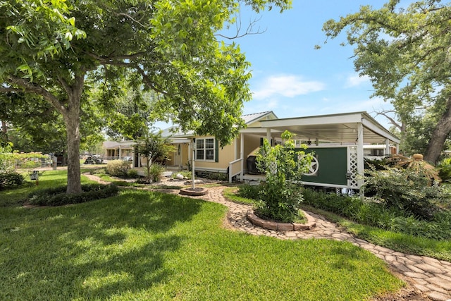 639 Manor St, Houston, TX 77015 - view of front of home with a front yard, covered porch, and an attached carport