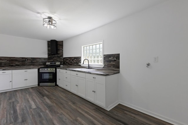 639 Manor St, Houston, TX 77015 - kitchen featuring stainless steel gas range, a sink, range hood, and decorative backsplash