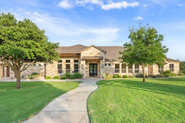 535 Creekside Dr, Salado, TX 76571 - view of front of property featuring french doors, stone siding, and a front yard
