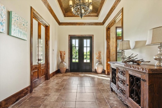 535 Creekside Dr, Salado, TX 76571 - foyer entrance featuring a raised ceiling, french doors, a chandelier, baseboards, and crown molding