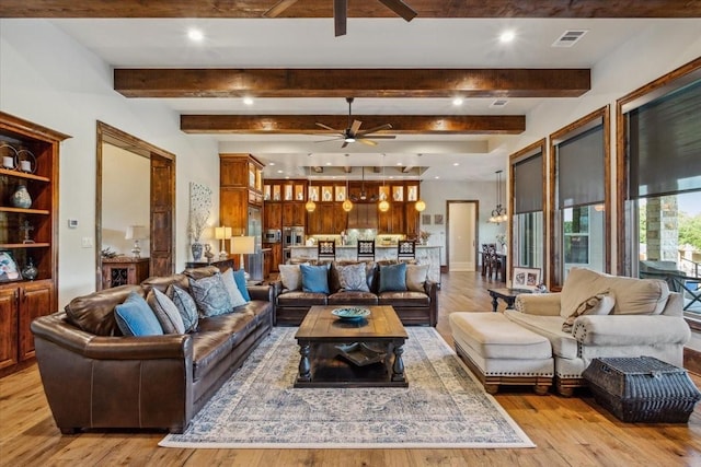 535 Creekside Dr, Salado, TX 76571 - living area with a ceiling fan, light wood-style flooring, beamed ceiling, and recessed lighting