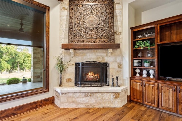 535 Creekside Dr, Salado, TX 76571 - living room featuring a fireplace, wood finished floors, and ceiling fan