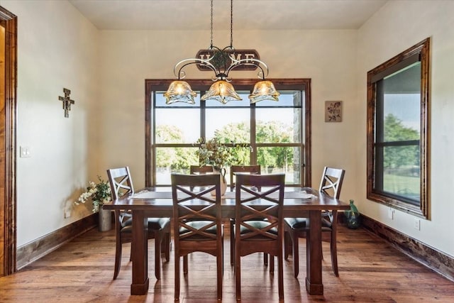 535 Creekside Dr, Salado, TX 76571 - dining area with wood finished floors, a chandelier, and baseboards