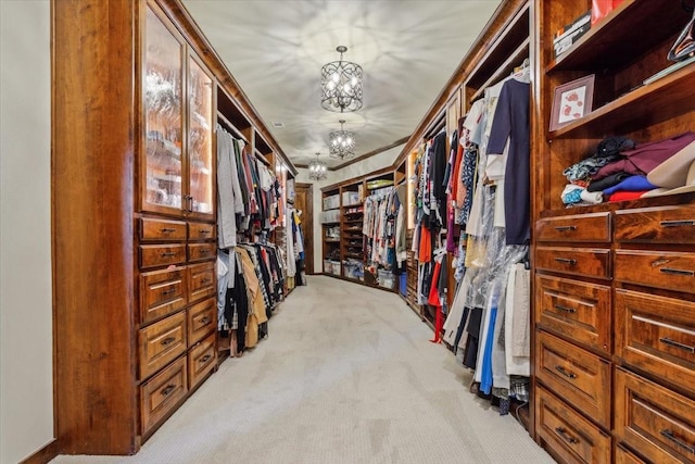 535 Creekside Dr, Salado, TX 76571 - walk in closet featuring light colored carpet and a chandelier