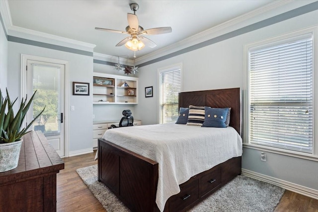 535 Creekside Dr, Salado, TX 76571 - bedroom with wood finished floors, crown molding, baseboards, and a ceiling fan