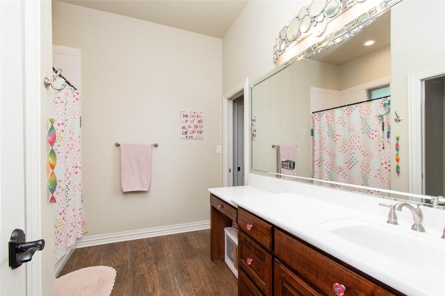 535 Creekside Dr, Salado, TX 76571 - full bath featuring vanity, wood finished floors, baseboards, and curtained shower