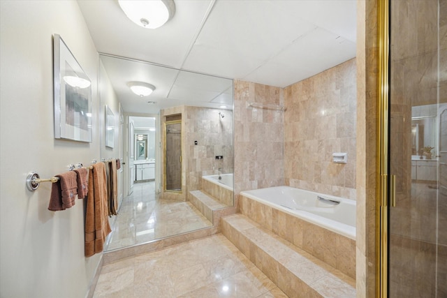 101 Westcott St Unit 305, Houston, TX 77007 - bathroom with a garden tub, a shower stall, marble finish floors, and tile walls