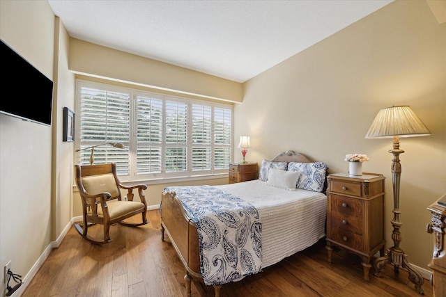 101 Westcott St Unit 305, Houston, TX 77007 - bedroom featuring dark wood finished floors and baseboards