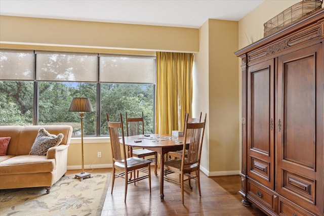 101 Westcott St Unit 305, Houston, TX 77007 - dining room with baseboards and dark wood-style floors