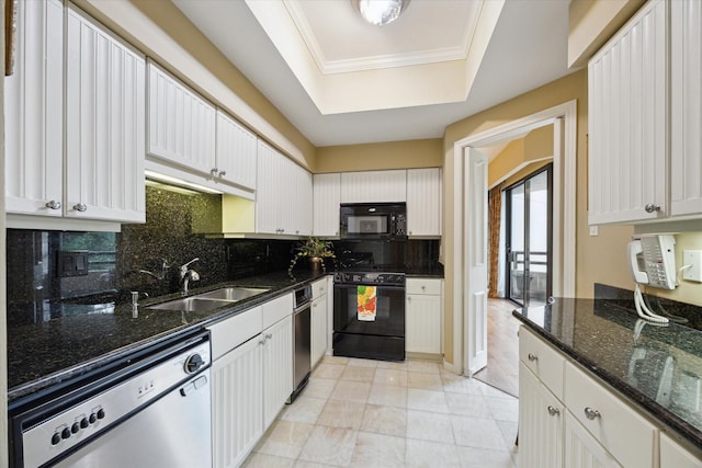 101 Westcott St Unit 305, Houston, TX 77007 - kitchen featuring black appliances, a sink, a tray ceiling, tasteful backsplash, and white cabinets