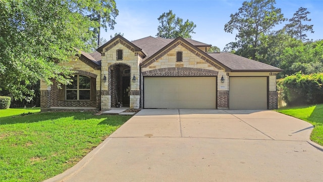 8992 S Comanche Cir, Willis, TX 77378 - french country inspired facade with an attached garage, brick siding, concrete driveway, and a front yard