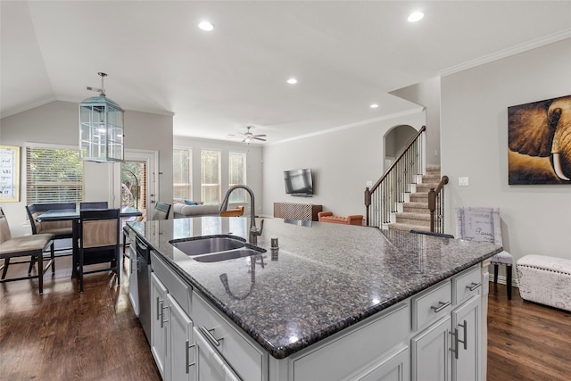 8992 S Comanche Cir, Willis, TX 77378 - kitchen featuring a sink, open floor plan, recessed lighting, dark wood finished floors, and decorative light fixtures