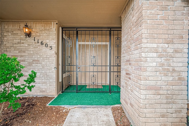 11605 Southlake Dr Unit 32, Houston, TX 77077 - doorway to property with brick siding