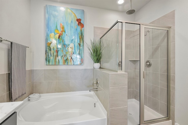 9013 Lonestar Creekbend Ln, Houston, TX 77080 - full bath featuring a stall shower, a garden tub, and vanity