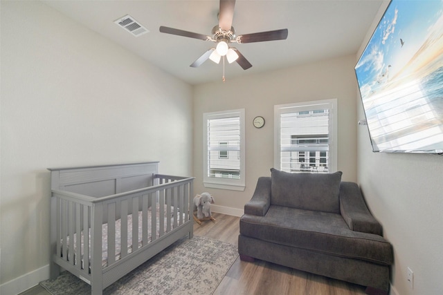 9013 Lonestar Creekbend Ln, Houston, TX 77080 - bedroom featuring wood finished floors, baseboards, and ceiling fan