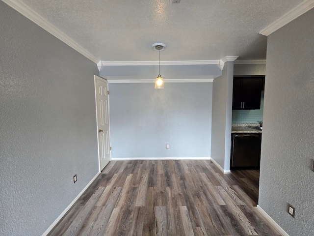 1860 White Oak Dr Unit 314, Houston, TX 77009 - unfurnished dining area featuring dark wood-style flooring, ornamental molding, baseboards, a textured wall, and a textured ceiling