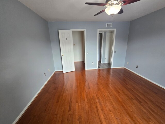 1860 White Oak Dr Unit 314, Houston, TX 77009 - empty room with ceiling fan, baseboards, and wood finished floors