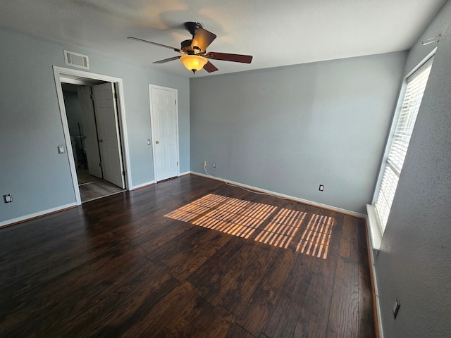 1860 White Oak Dr Unit 314, Houston, TX 77009 - unfurnished bedroom featuring wood finished floors, baseboards, a ceiling fan, and connected bathroom