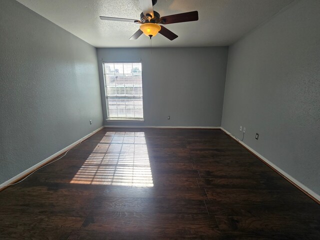 1860 White Oak Dr Unit 314, Houston, TX 77009 - unfurnished room with ceiling fan, baseboards, wood finished floors, and a textured wall
