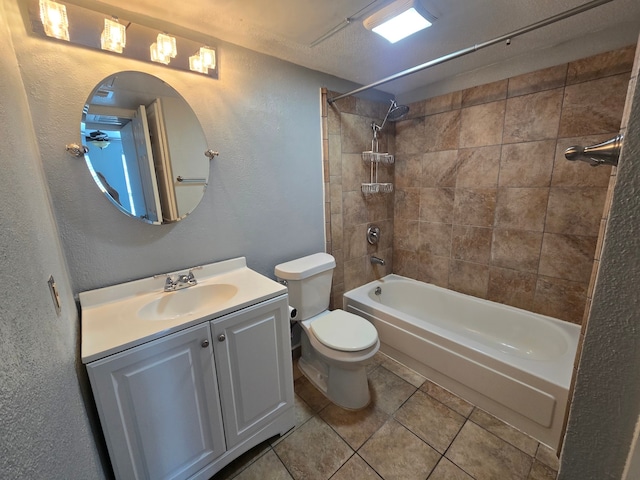 1860 White Oak Dr Unit 314, Houston, TX 77009 - full bathroom featuring toilet, shower / bathtub combination, vanity, tile patterned flooring, and a textured wall