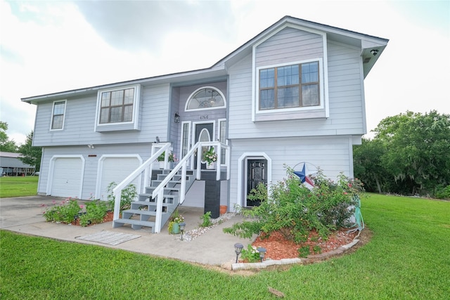 4746 County Road 502d, Sweeny, TX 77480 - raised ranch featuring a front yard, an attached garage, and concrete driveway