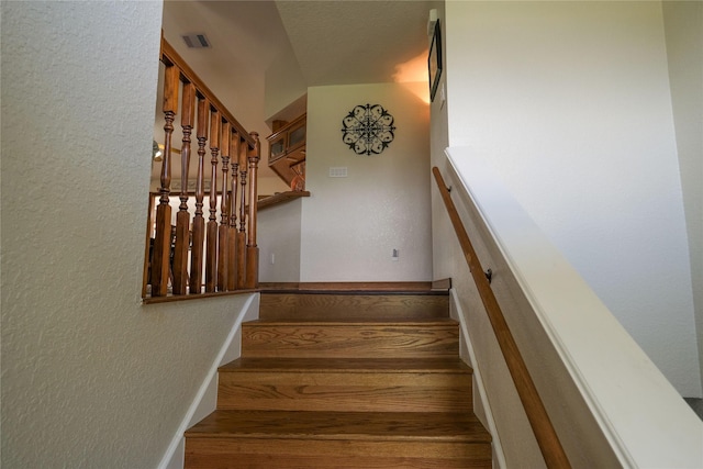 4746 County Road 502d, Sweeny, TX 77480 - staircase featuring a textured wall