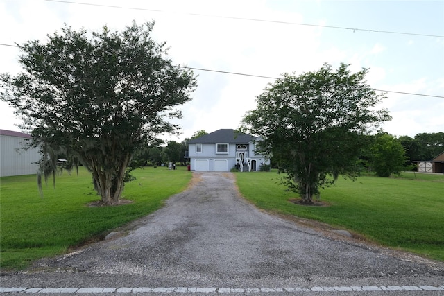 4746 County Road 502d, Sweeny, TX 77480 - split foyer home with a garage, a front lawn, and asphalt driveway