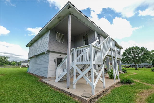 4746 County Road 502d, Sweeny, TX 77480 - rear view of property featuring a yard, a patio area, and stairs