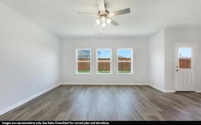 3523 Prairie Rose Trl, Angleton, TX 77515 - spare room with wood finished floors, a ceiling fan, and baseboards