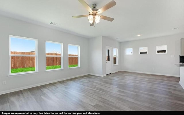 3523 Prairie Rose Trl, Angleton, TX 77515 - unfurnished living room featuring a ceiling fan, wood finished floors, baseboards, and recessed lighting