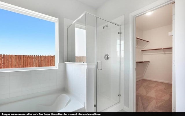 3523 Prairie Rose Trl, Angleton, TX 77515 - full bath featuring a shower stall, a bath, a walk in closet, and baseboards